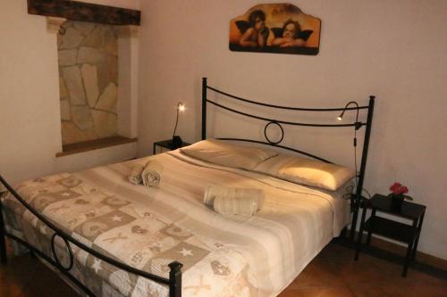 a bedroom with a large bed with white sheets at porta marina ortigia in Siracusa