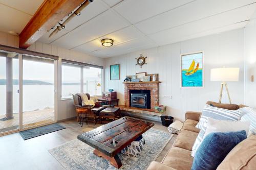 a living room with a couch and a table at Eastpoint Escape in Langley