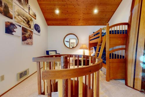 a room with a staircase and a bunk bed at Eastpoint Escape in Langley