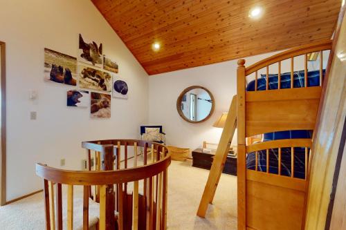 a room with a staircase and a mirror at Eastpoint Escape in Langley