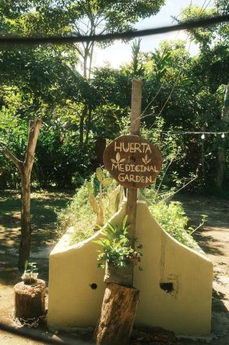 a sign that reads luana mexicanamerican garden at Salvia Madre Hotel Boutique in Guachaca
