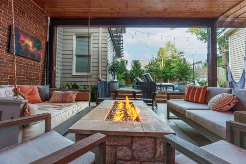 a patio with couches and a fire pit at The Classy Craftsman - Beautiful Decor & Pool in Atlanta