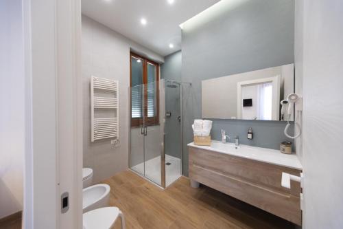 a bathroom with a sink and a shower at City Rooms 74 in Salerno
