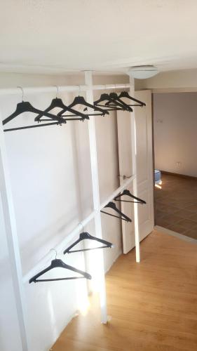 a room with black shelves on a wall at House with view and jacuzzi in Adeje in Adeje