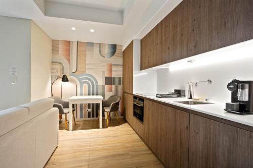 a kitchen with a sink and a counter at Santos Luxury Studio and Gym V in Lisbon