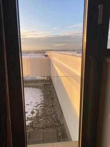 a view of an airport runway from a window at Hotel TheGreen in Cologne