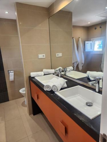 a bathroom with a sink and a mirror at LAALCAZABA Garden in Marbella