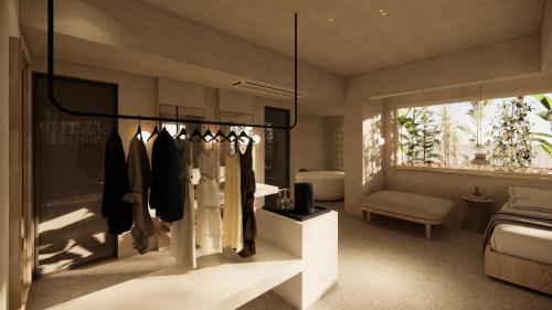 a dressing room with a rack of clothes at La Gaia - Adult Only in Alanya