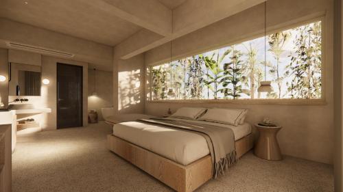a bedroom with a large bed and a large window at La Gaia - Adult Only in Alanya