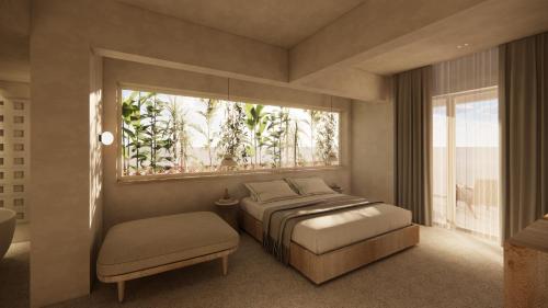 a bedroom with a bed and a window at La Gaia - Adult Only in Alanya
