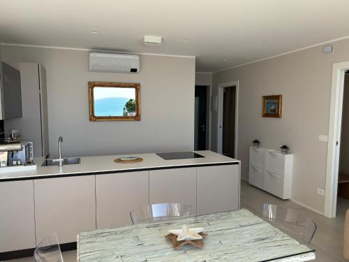 a kitchen with a table with a starfish on it at Seaside Resort in Trieste