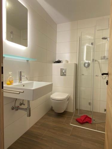 a bathroom with a toilet and a sink and a shower at Pension Jagerhof - Sommercard Inkl - 5 Min zum Hochzeiger in Jerzens