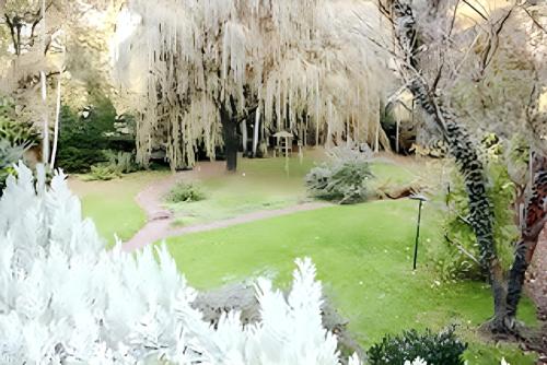 a rendering of a golf course with a weeping willow tree at Spacious house with garden in Comblain-au-Pont in Comblain-au-Pont