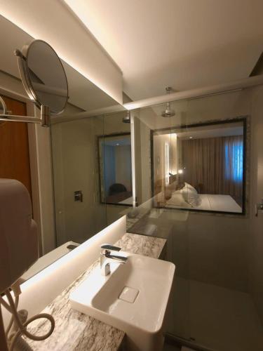 Ένα ή περισσότερα κρεβάτια σε δωμάτιο στο Hotel Sonata de Iracema