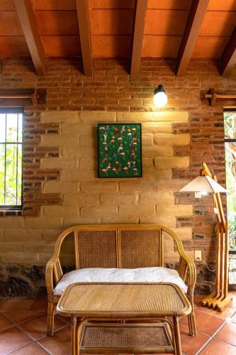 a wooden wall with a bench and a table at Charming cabin with Scenic view in Tepoztlán in Tepoztlán