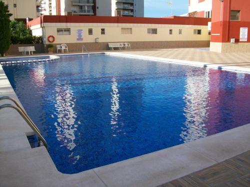 Bazén v ubytování PRIMERA LINEA DE PLAYA con garaje nebo v jeho okolí