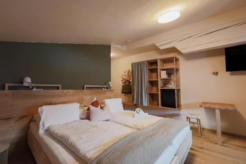 Cama o camas de una habitación en biYou Ecoquartier in den Bergen