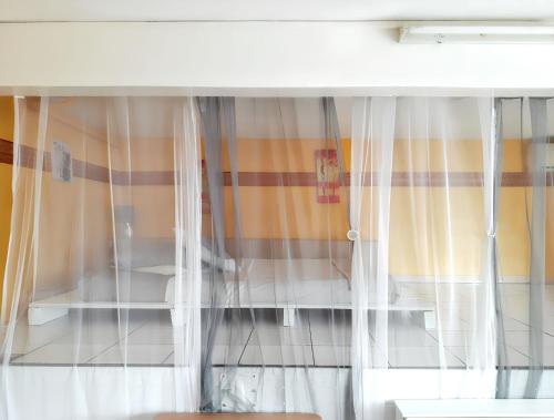 Ένα ή περισσότερα κρεβάτια σε δωμάτιο στο Studio confortable à Vieux Habitants 50 m² avec vue mer