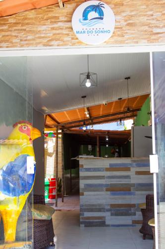 a view of a store front with a sign on it at Pousada Mar do Sonho Vila in Porto De Galinhas