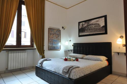 Una cama o camas en una habitación de Roma sogno infinito