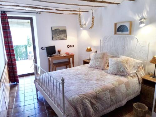 a bedroom with a white bed in a room at Spacious House in Hornos with Mountain View in Hornos