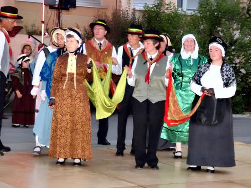 a group of people dressed in costumes in a parade at Maison confortable au cœur de Brioude avec parking privé. in Brioude