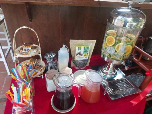 a red table with a blender and food on it at Lux Home Phước Hải 2 in Hội Mỹ