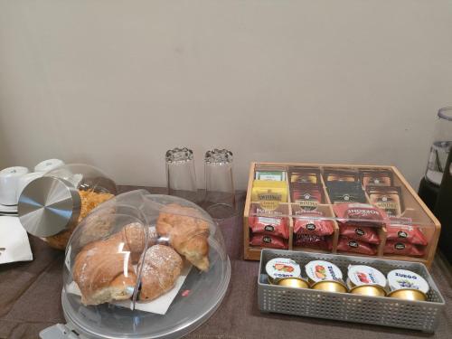 a table with a bunch of different types of pastries at Malva B&B in Reggio Calabria