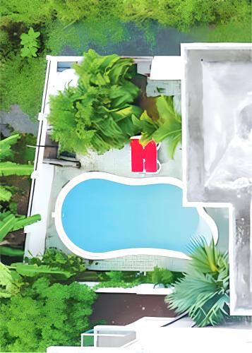 an aerial view of a house with a pool at Modern apartment in Pereybère with pool view, 50 m² in Pereybere