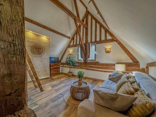 a living room with a blue couch in a building at Le Temps des Rêves in Chartres