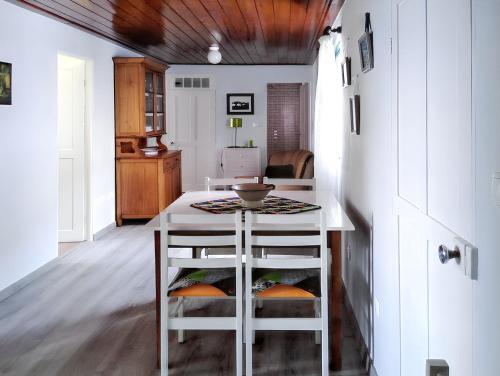a kitchen with a table and two stools at House with sea view in Santo Amaro, 212 sq m, terrace in Santo Amaro