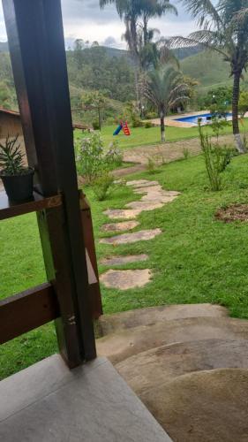a view from a door of a walkway at Sitio Azeite com Pimenta in Itabirito