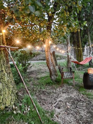 a hammock in a park with lights under a tree at Cozy Apartment in Ardanué with View in Ardanué