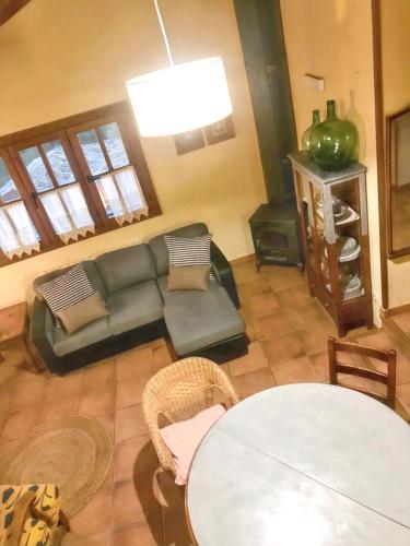 a living room with a couch and a table at Cozy Apartment in Ardanué with View in Ardanué
