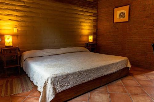 Katil atau katil-katil dalam bilik di Cabaña en Tepoztlán con vista a la montaña