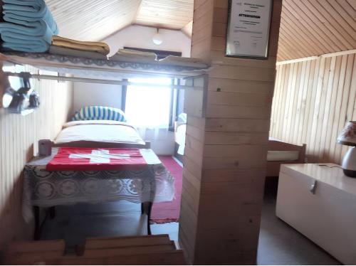 a small room with a bed in a tiny house at Cozy House in Jazvine with Garden in Jazvine