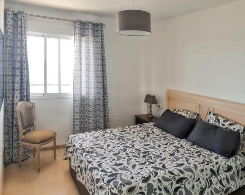 A bed or beds in a room at Spacious Apartment with Sea View in Estepona - 140 m²