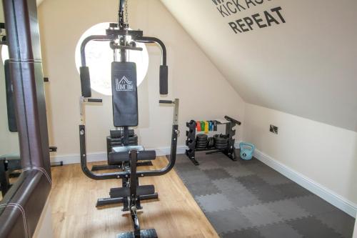 a gym with tread machines in a attic at Gym I Cinema I Hot tub I Games room at Copper Beech in Shrewsbury