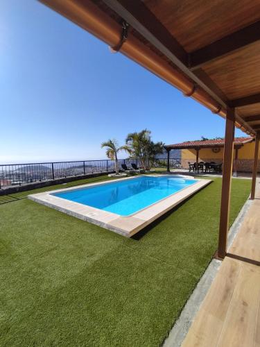 a swimming pool with a view of the ocean at Casa Amelina in El Paso