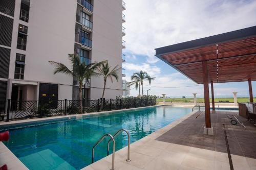 a swimming pool in the middle of a building at Exclusive condo with spectacular SEA VIEW! in Santa Marta
