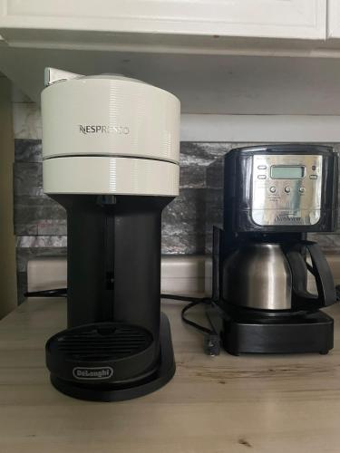 a coffee maker and a coffeemaker on a counter at Sunrise and Bayview with SNOW SHOES, WATERCRAFTS , BIKES in Meaford