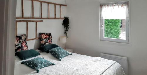 Postel nebo postele na pokoji v ubytování Maison charmante à Colleville-Montgomery avec jardin clos