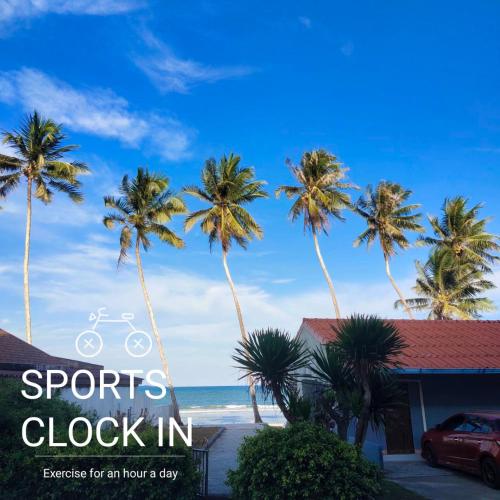 an image of palm trees in front of a house at SEA VIEW BEDs บ้านบอส หาดทุ่งวัวแล่น ชุมพร in Ban Phru Ching (1)