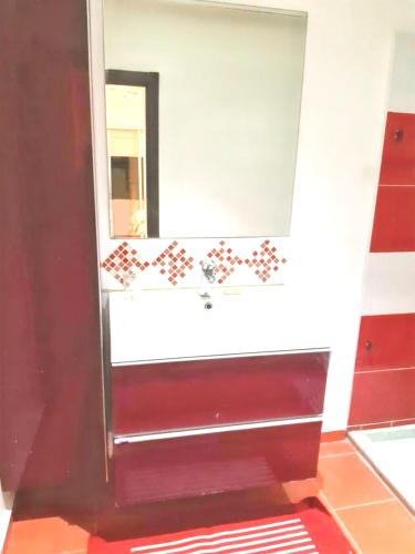 a bathroom with a sink and a mirror at Spacious apartment in Nouaseur of 167 m² in Nouaseur