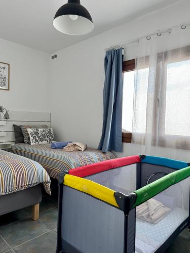 Ένα ή περισσότερα κρεβάτια σε δωμάτιο στο Lovely Casa Deseada