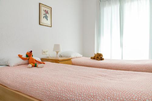 Ένα ή περισσότερα κρεβάτια σε δωμάτιο στο Baconer - Casa en l'Ampolla con jardín privado y acceso directo al mar - Deltavacaciones