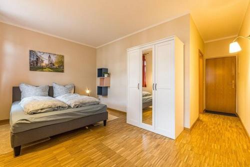 Katil atau katil-katil dalam bilik di Stadtgut Mölkau Apartment