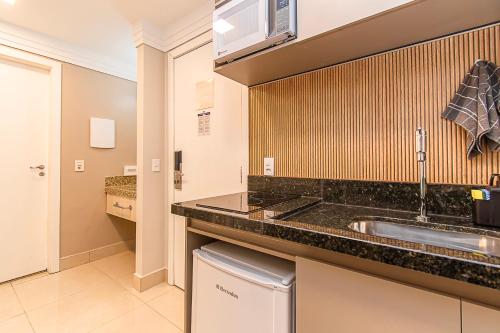 a kitchen with a sink and a counter top at BSB STAY Torre Flats Particulares - Mercure Líder in Brasilia