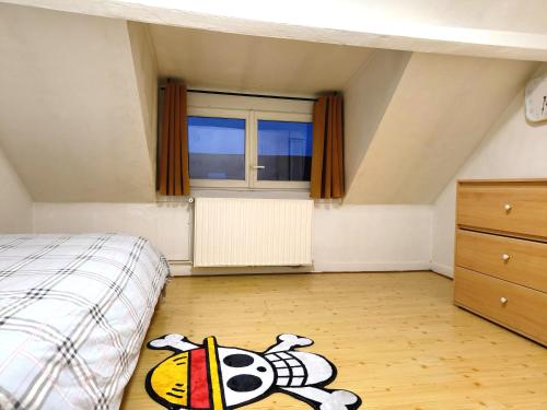 Ένα ή περισσότερα κρεβάτια σε δωμάτιο στο Homestay Tourcoing