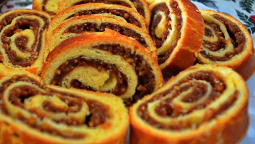 a pile of cinnamon roll rolls on a table at Pensiunea Inima Maramureșului in Breb